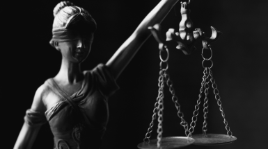 Allegoric reproduction of justice as a blindfolded woman holding a scale