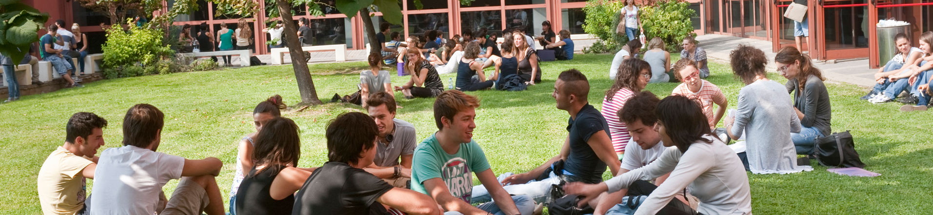 Bicocca students sitting out of the university